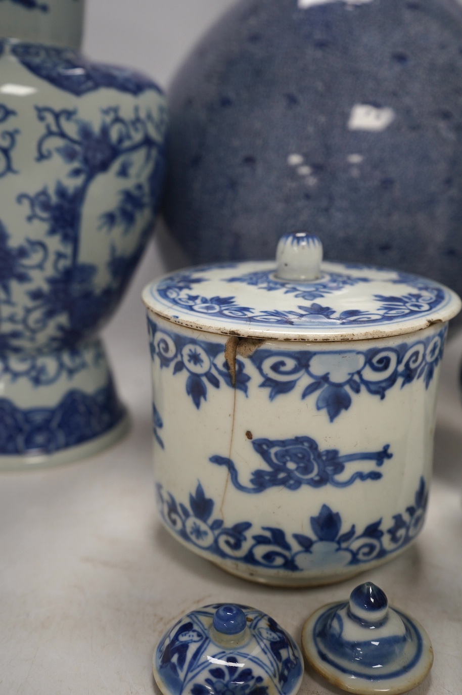 Four Chinese blue and white vases, a jar and cover and a tea bowl, Kangxi to 20th century, tallest vase 38cm high. Condition - poor